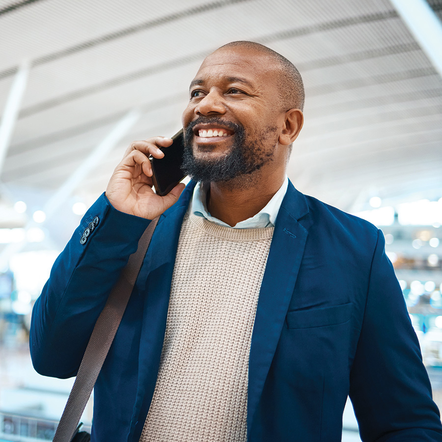 black-man-airport-and-business-call-with-a-smile-2023-11-27-05-31-59-utc